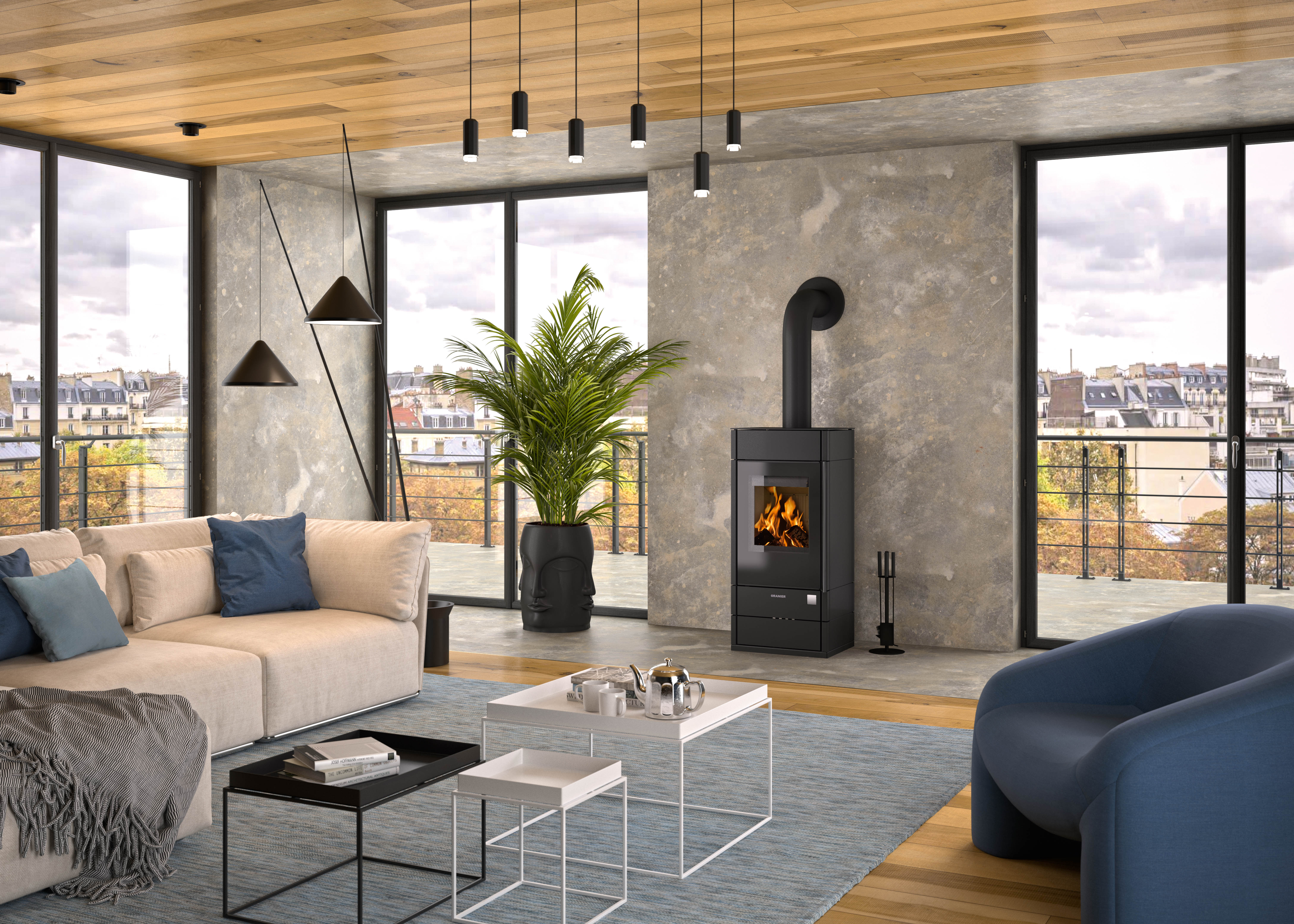 Penthouse Wohnzimmer modisch eingerichtet mit Sofa und Kaminofen Teja.